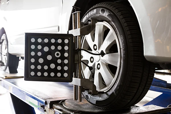 wheel with alignment machine target attached